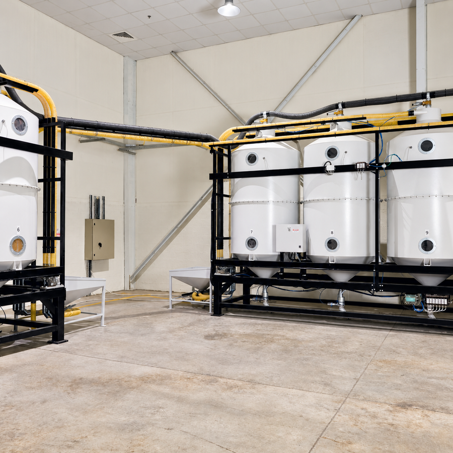 Coffee storage and handling equipment inside the Mood Espresso roastery