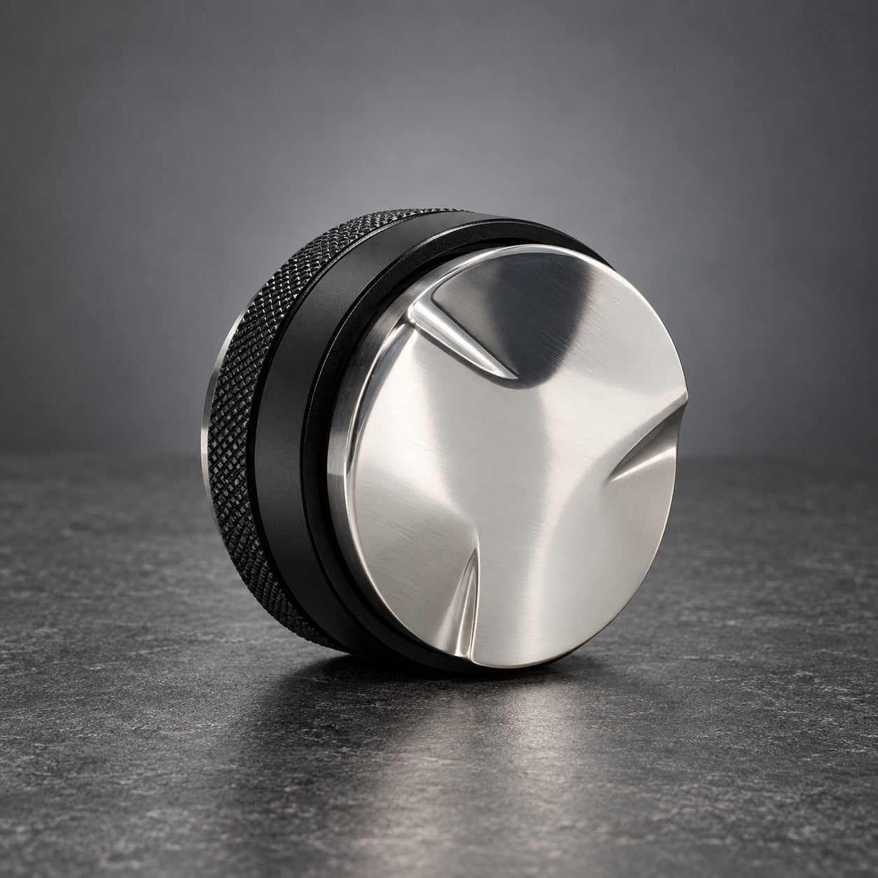 58 mm dual sided coffee distributor and tamper showing the distribution face