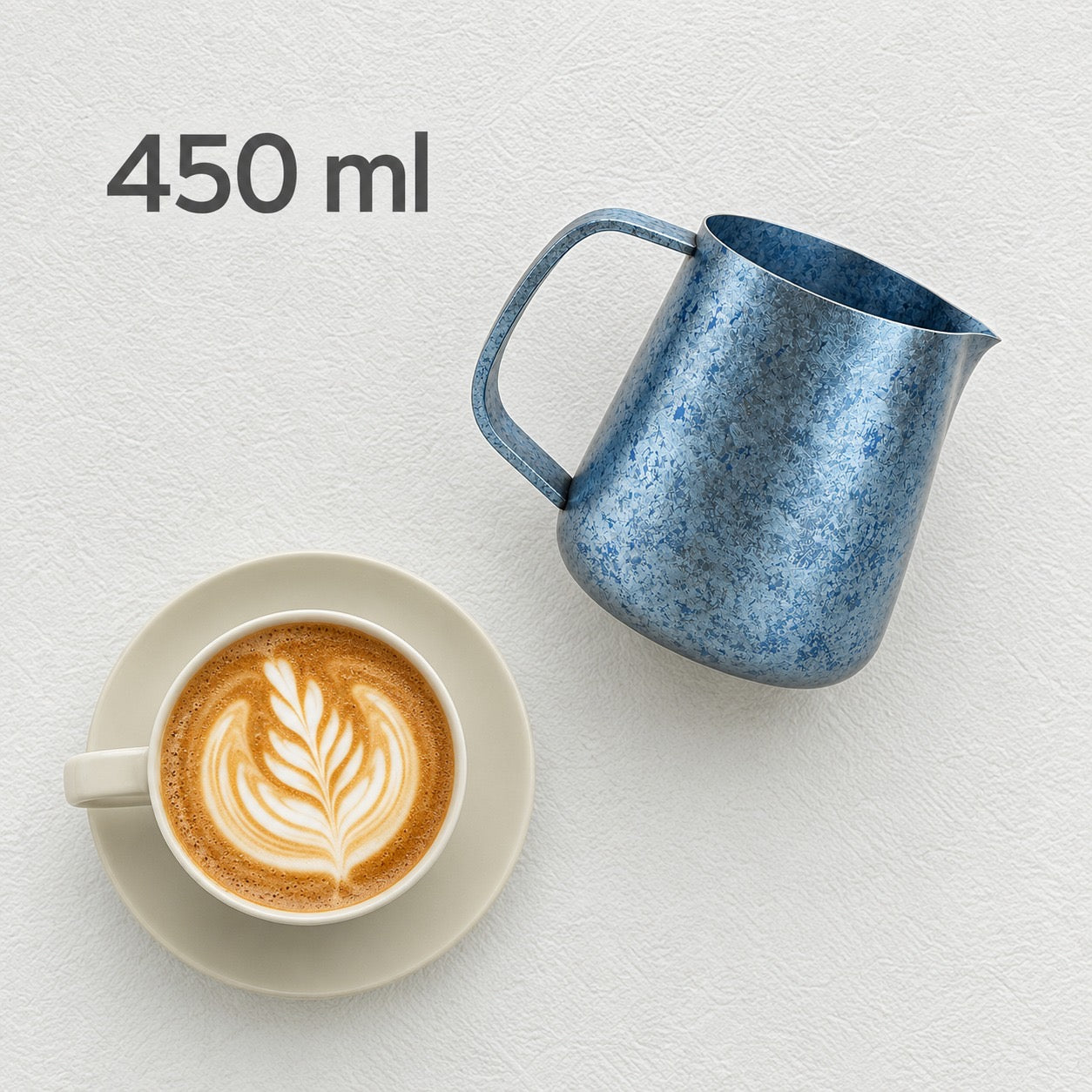 Blue 450 ml milk pitcher beside a latte, cup not included